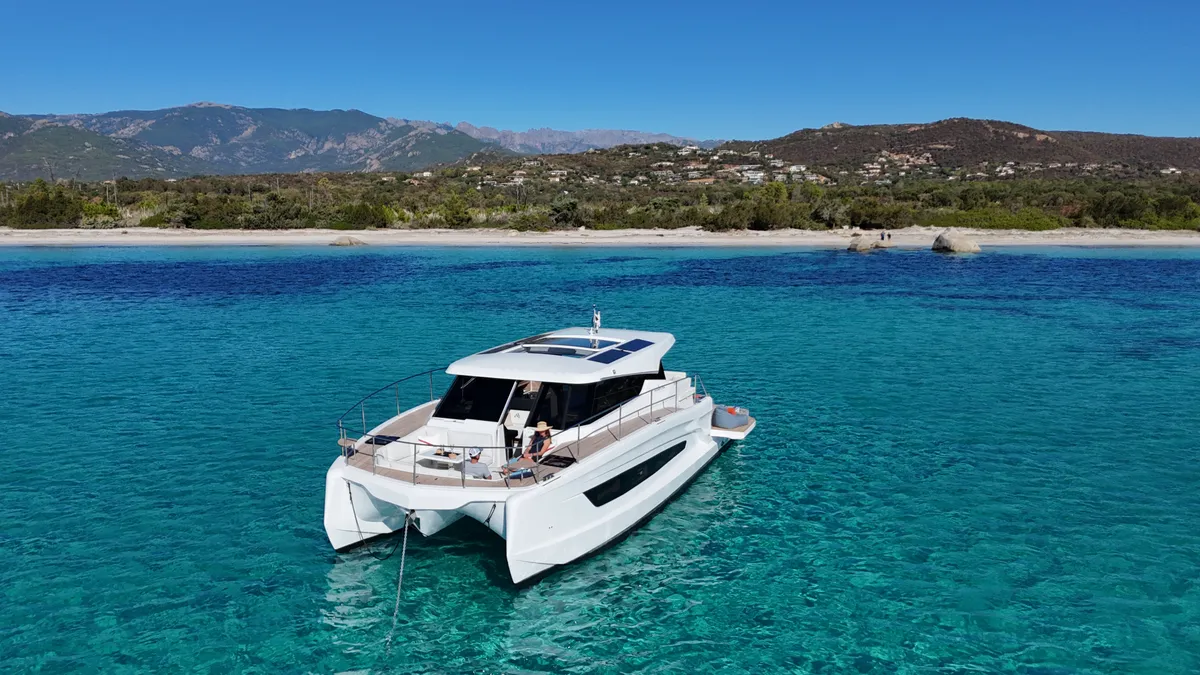 Happy guests enjoying a catamaran cruise on the Athens Riviera